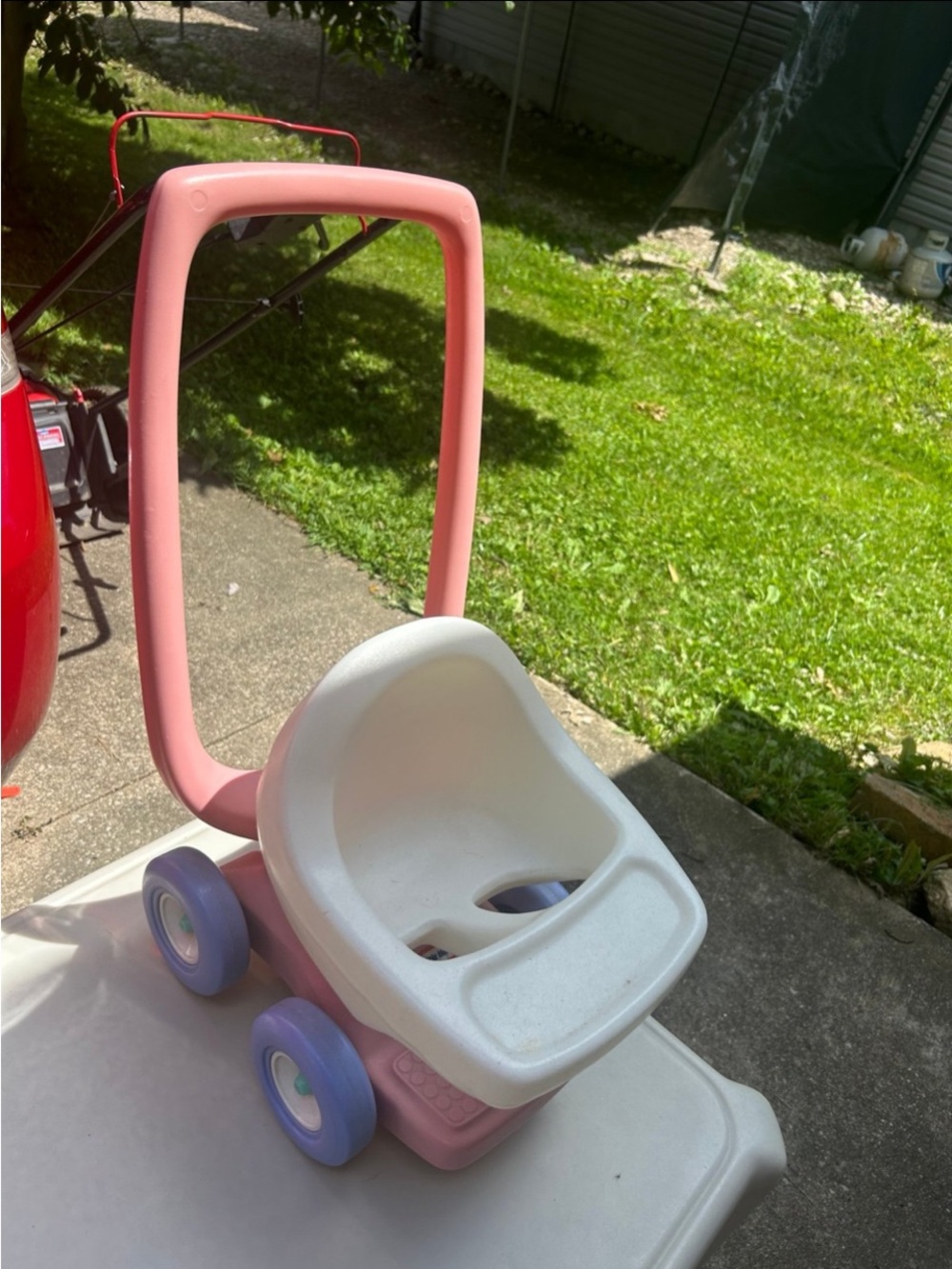 Pink and White Toddler Push Walker Ride-On with Purple Wheels